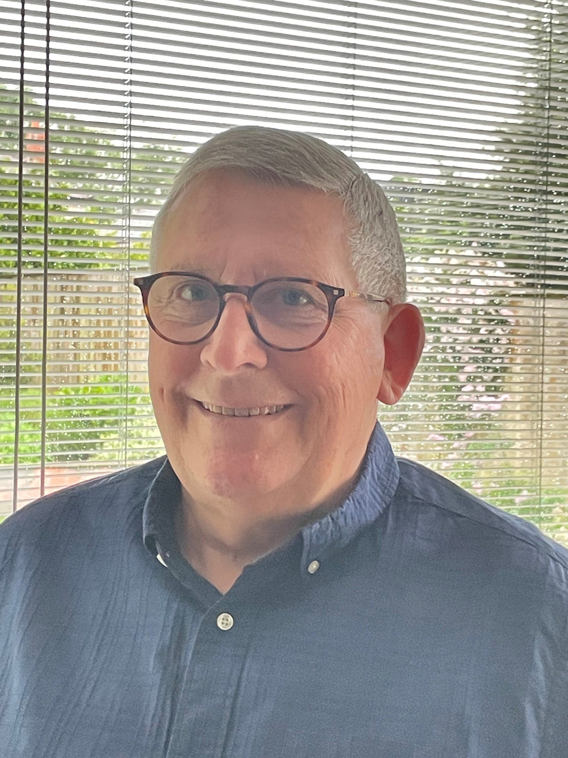 Headshot of Derek Howell.