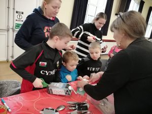 Children and volunteers take part in an activity at Tregaron Family Centre.